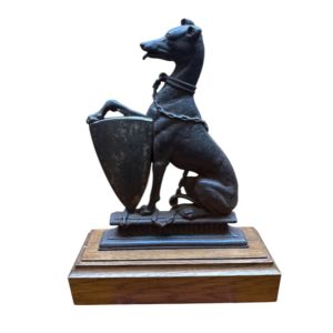 A Victorian cast iron door step modelled as a greyhound.