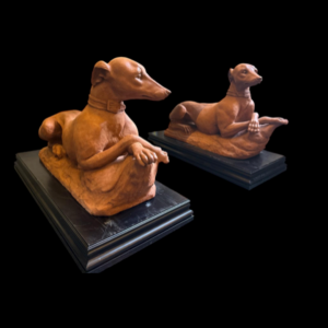 A Pair of Italian Terracotta Models of Recumbent Whippets, Late 19th century