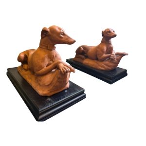 A Pair of Italian Terracotta Models of Recumbent Whippets, Late 19th century