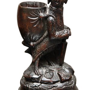 A Charming Swiss carved black Forest toothpick or match holder in the form of an anthropomorphic hound Circa 1890