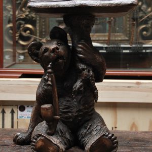 An Unusual Swiss Carved Black Forest Smoking Table