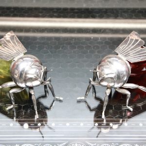 Two silver plated and glass preserve pots in the form of bees